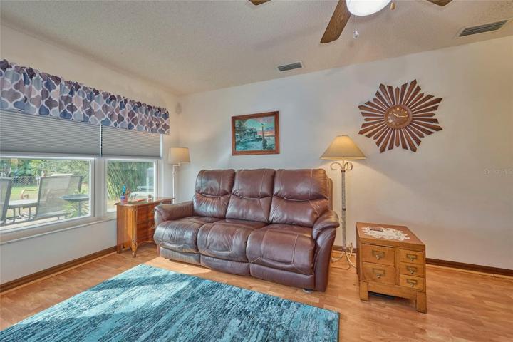 Family room has new hurricane rated windows and newer blinds