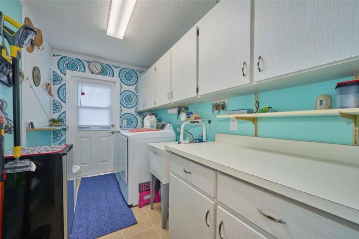 Laundry room is located inside the home