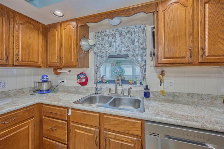 Kitchen has newer counter tops, sink and faucet.