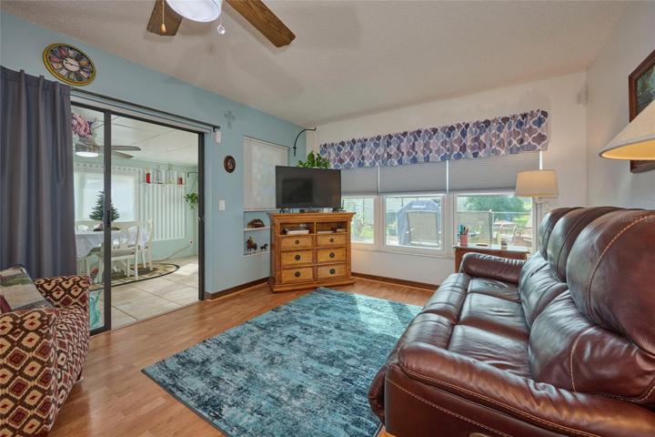 Family room with view out sliders to Florida room.