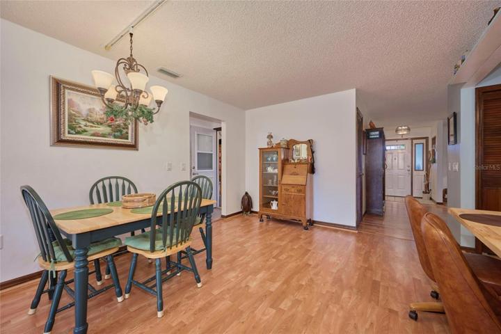 Dining area.  Doorway to left shows entrance to garage