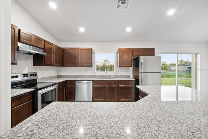 Kitchen w/ granite countertops and lots of cabinet space