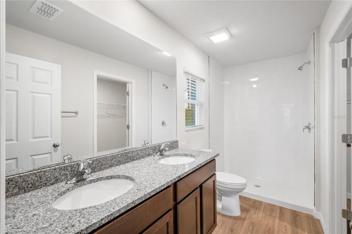 Master Bathroom w/ dual sinks and granite counters
