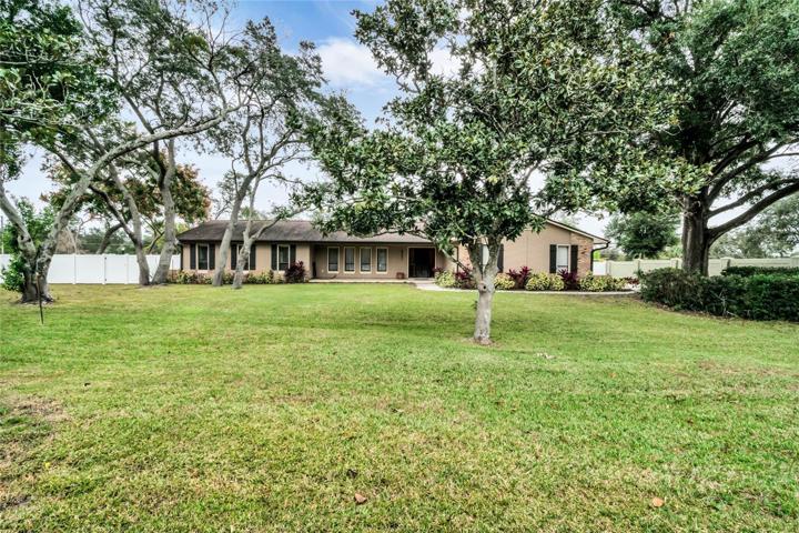 Welcome home to almost an acre of paradise!