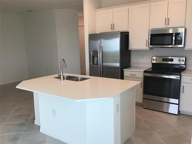 Kitchen with all stainless steel applicancses