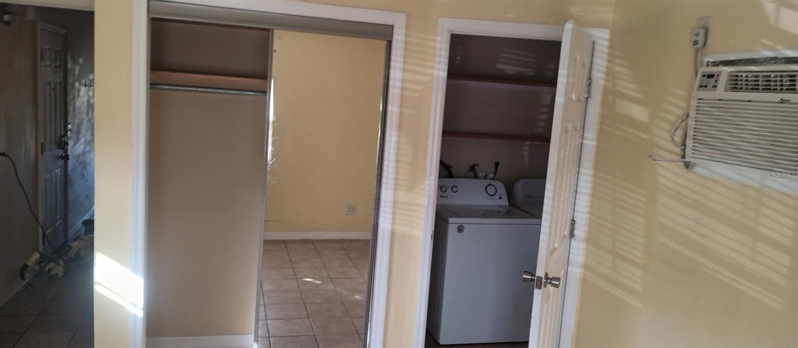 Bedroom Closet has sliding mirrored doors.  Economical through the wall AC/heat pump keeps you cool in the Summer and warm in the Winter.  Door on right leads to laundry room.