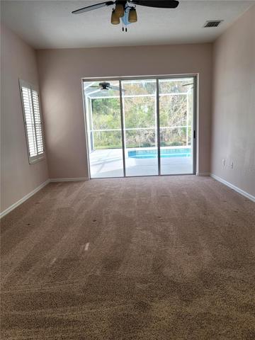 Spacious master with sliders to pool
