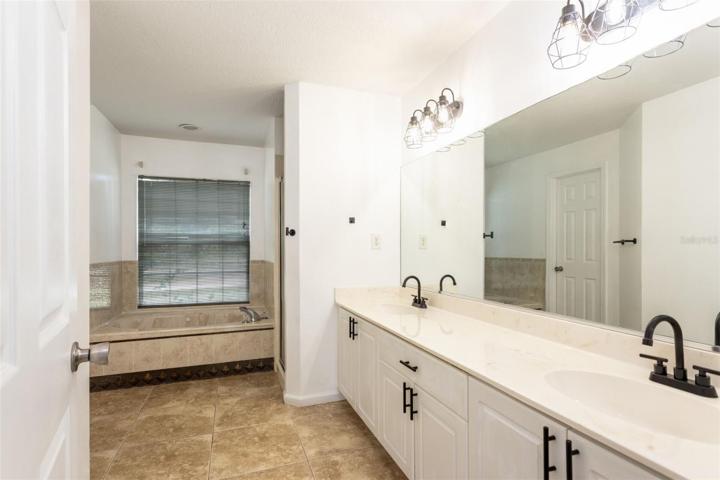 Ensuite double vanity with porcelain tile countertop