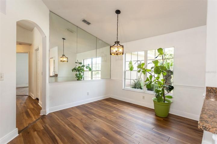 Full Dining Roon with mirrored wall. Loads of light pouring in!