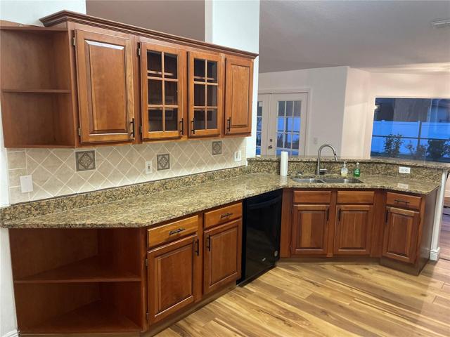 Solid cherry wood cabinetry through kitchen