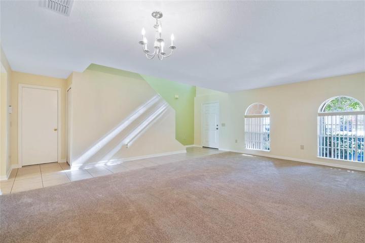 View from corner of living/dining room combo toward the front door.