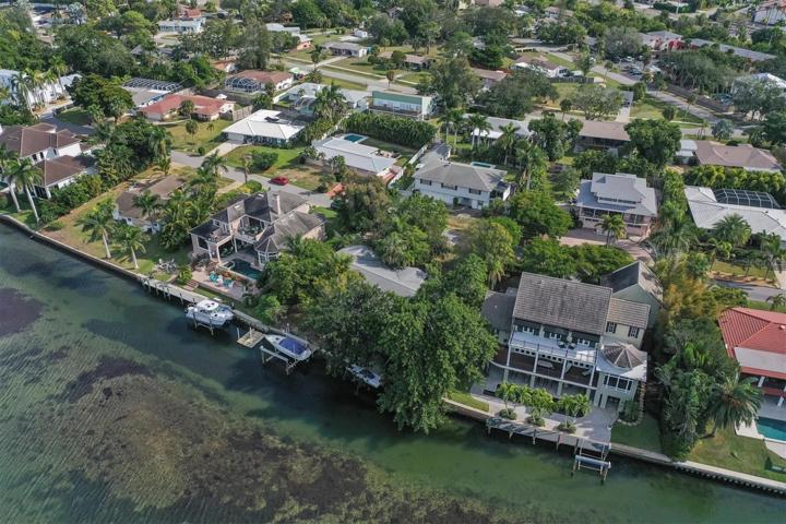 Discover an exceptional investor special, a golden opportunity to claim ownership of a Sarasota Bay/Intracoastal Waterfront property.