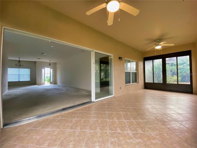 Tiled Floor with Acrylic Windows. Triple Slider to Living Room