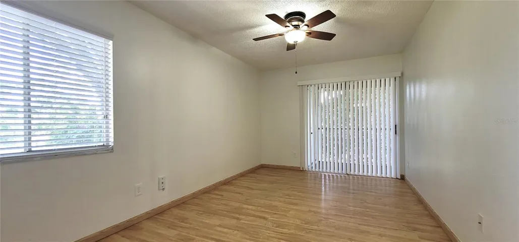 Bedroom 1 with sliders to your screened porch