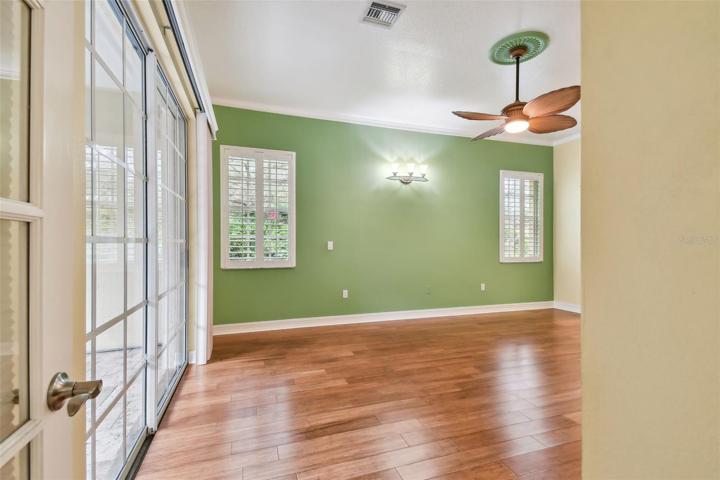 Primary bedroom; sliders and plantation shutters