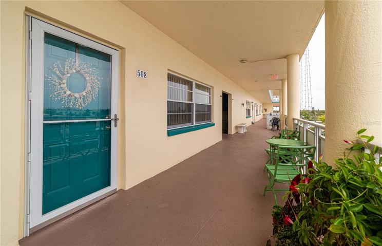 Front door with a little porch area