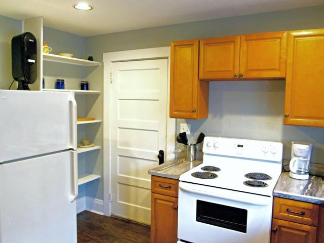Apartment 1 kitchen with door to laundry