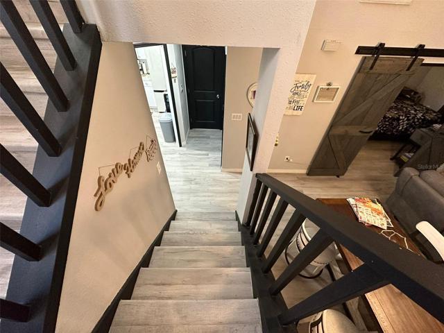 Look from the stairs platform towards the kitchen area, laundry and entrance