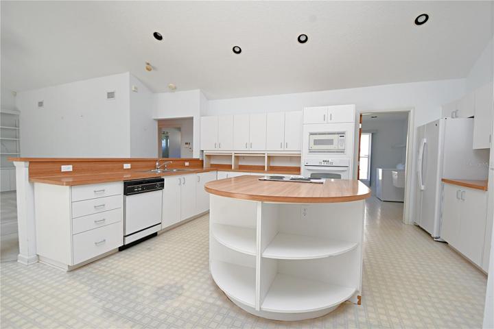 The kitchen has a large cooking island.