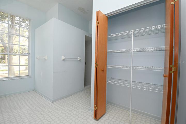 The ensuite (Jack and Jill bath) features a large linen closet.