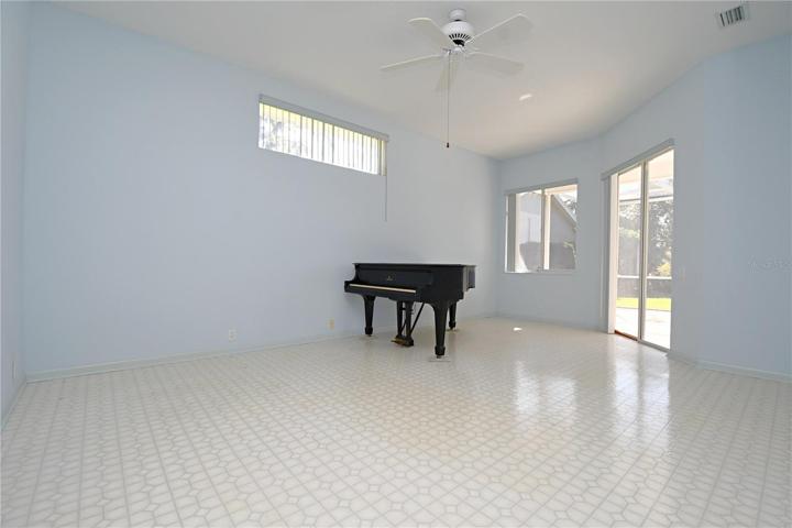Sliding glass doors lead to the screened in lanai from the primary bedroom.