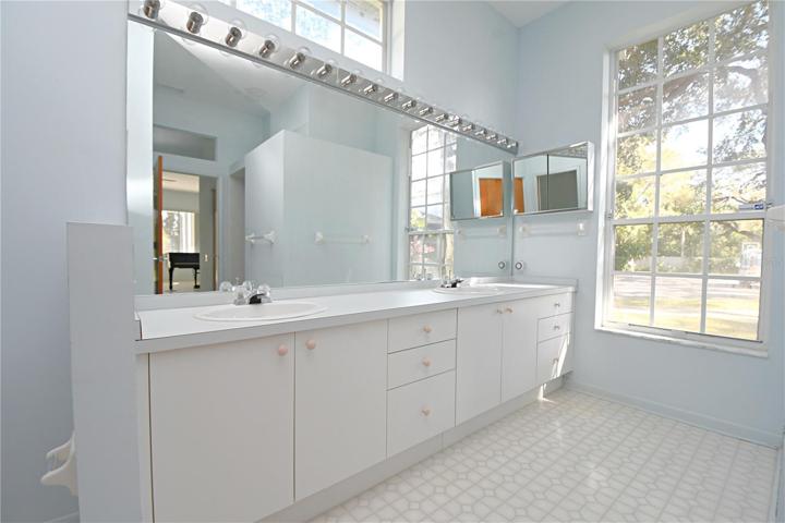 A light and bright ensuite with dual sink vanity.