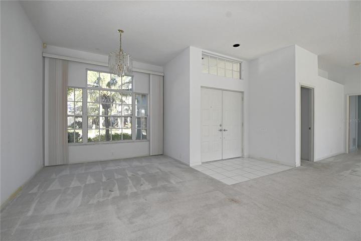 The dining room is situated between the living room and kitchen.