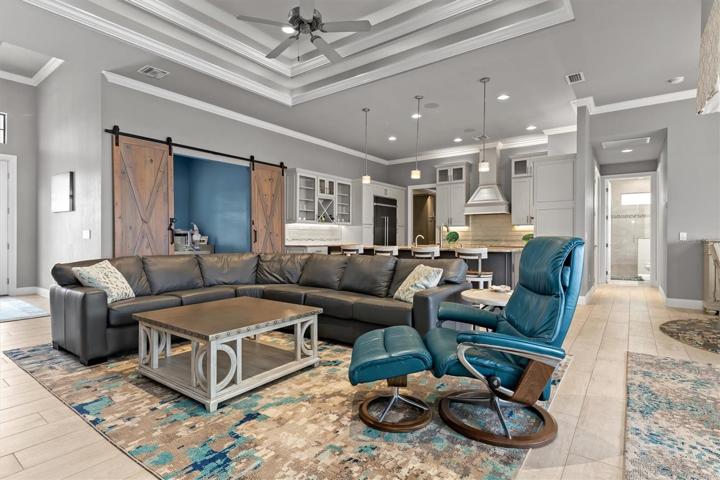 Lots of details to take in. High ceilings, crown molding, modern colors.