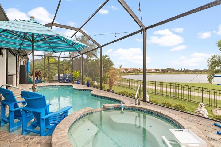 Saltwater heated pool and spa overlooking a lake in Burnt Store Isles.