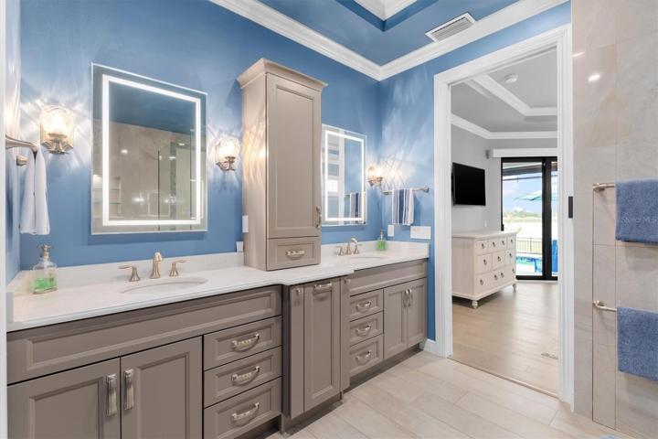 Double sinks and lighted wall mirrors