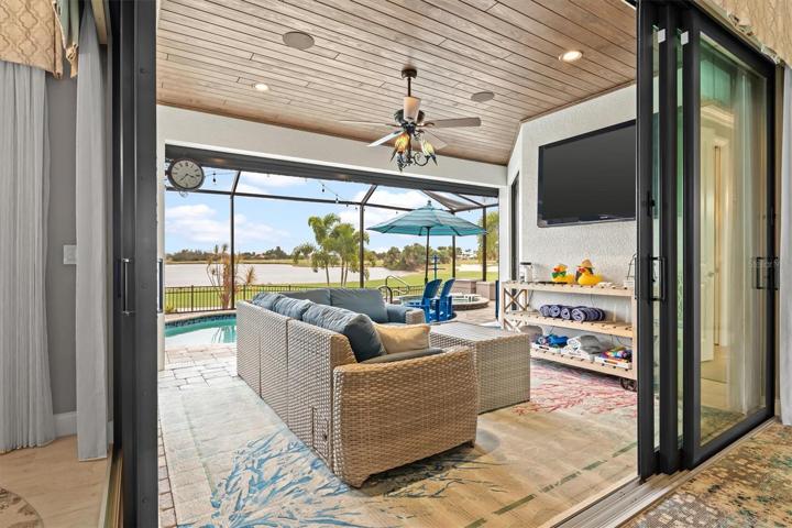Corner sliders out to lanai and pool.