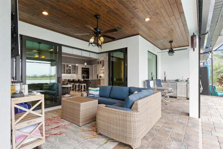 Planked ceiling gives the lanai a cozier feel.