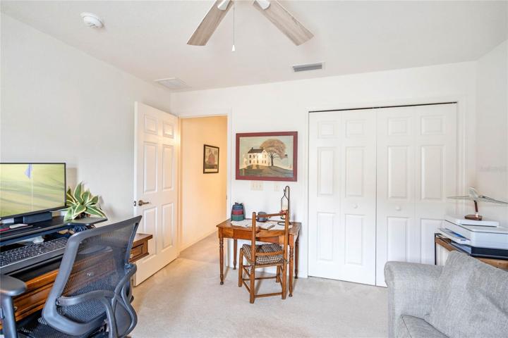 Bedroom #2 features Wall to Wall Carpeting & Ceiling Fan