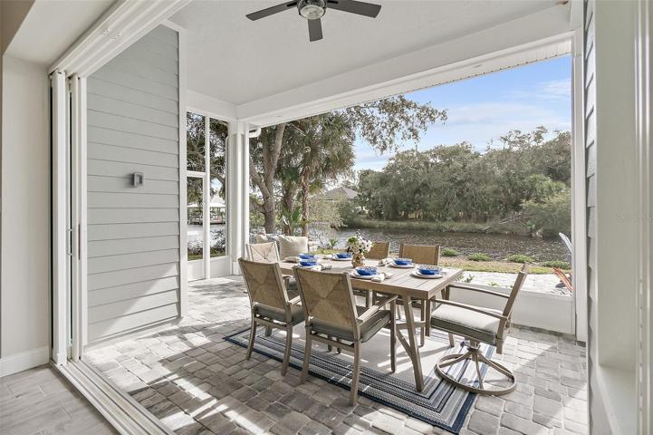Vanishing Sliders Lead to Lanai w/Canal Views