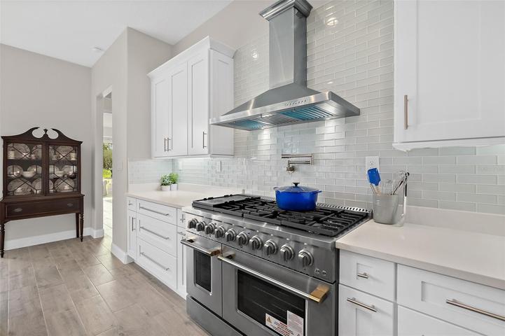 Commercial Gas Range, Quartz Countertops w/Tile Backsplash