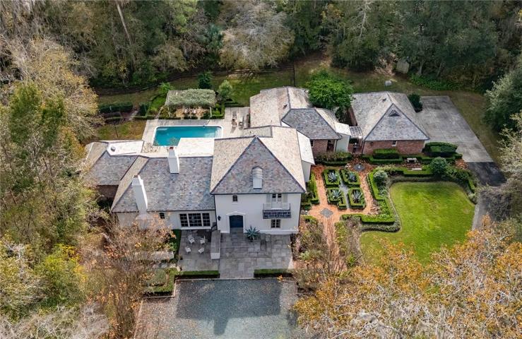 Immaculate landscaping and a view of the front of the home.