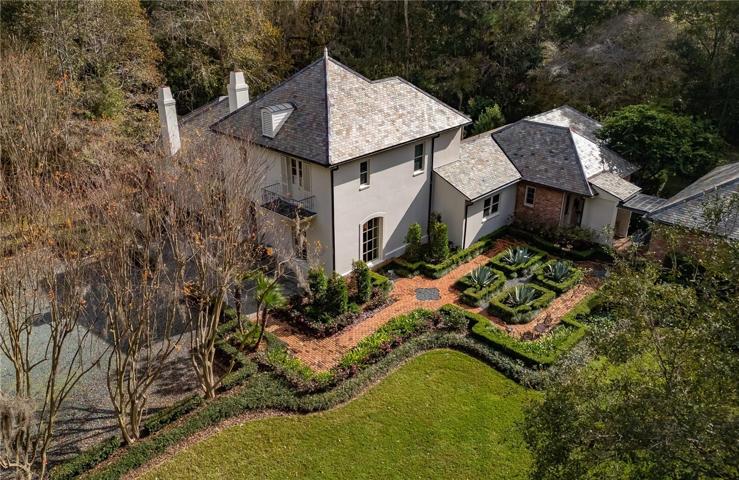 Front of house with views of the side garden.