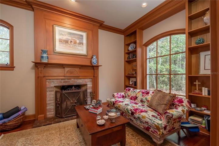 A formal study with fireplace.