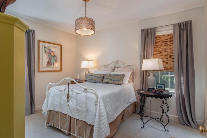 Third bedroom with modern light fixture.