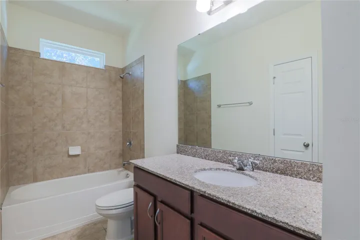 Bathroom 4 with shower & tub combo and lots of counter space!