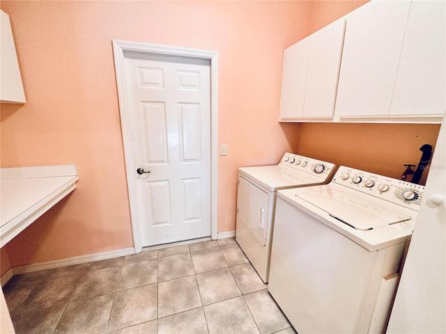 LAUNDRY ROOM WITH STORAGE AND FOLDING AREA