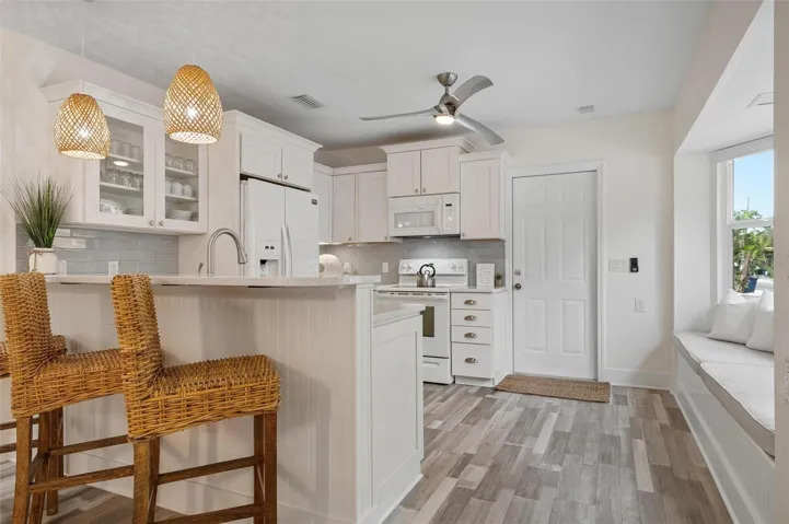 Kitchen with eat in bar area and window seat