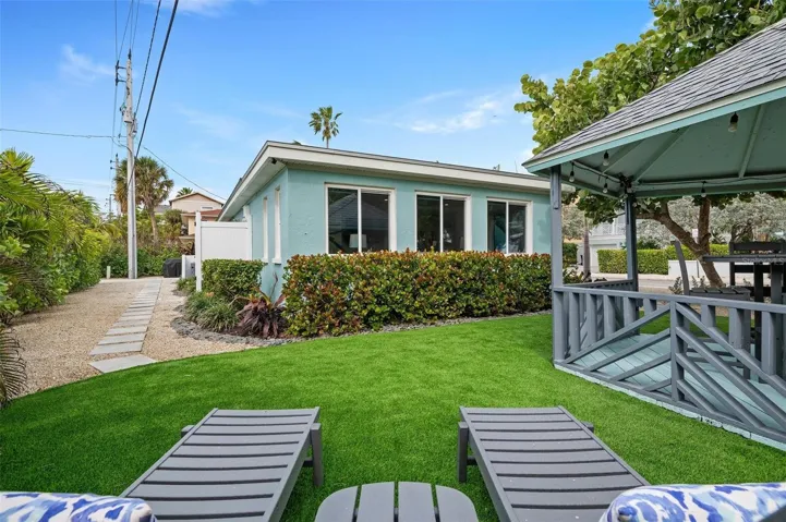 Side yard with turf and beautiful gazebo