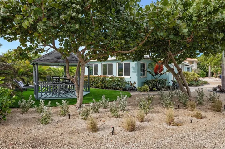 Side yard with turf and gazebo
