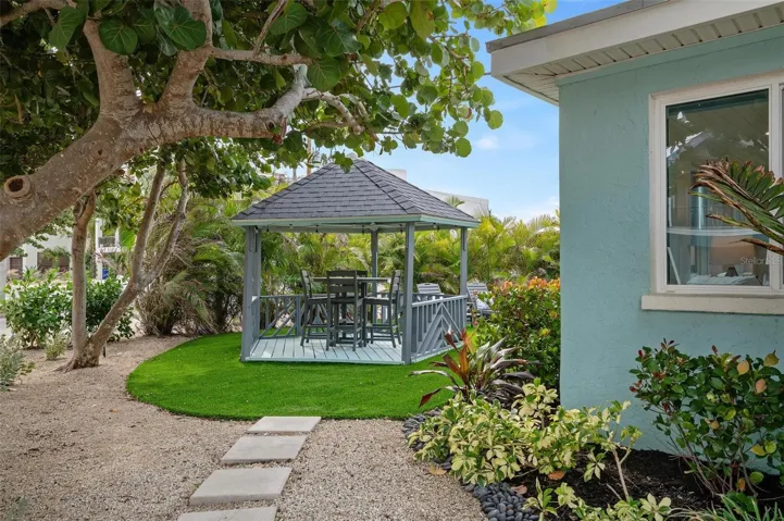 Side yard with turf and gazebo