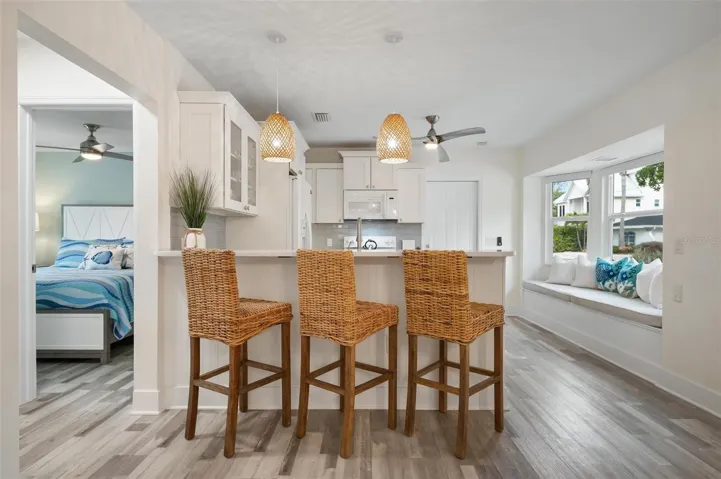 Kitchen with eat in bar area and window seat