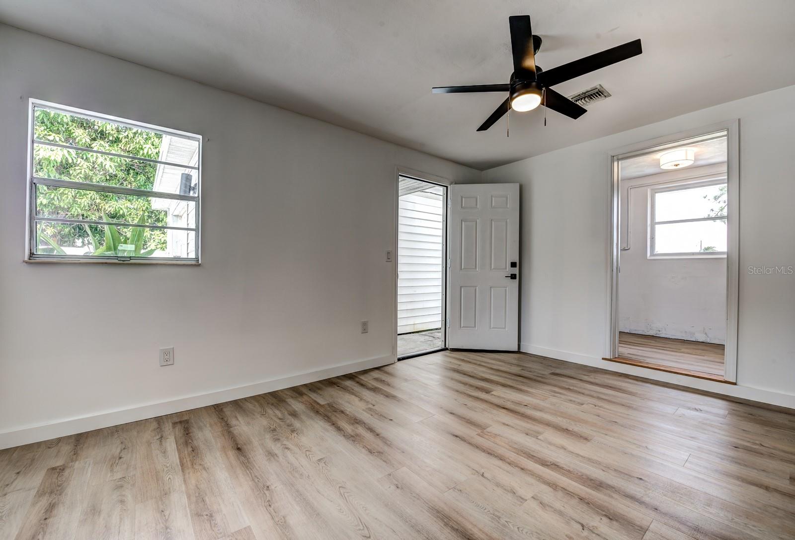 A door from the primary bedroom to the breezeway that adjoins the one car garage lends itself to be used as a separate space for the multi-generational family or work from home executive. The large storage and laundry room is found in the rear of the home.