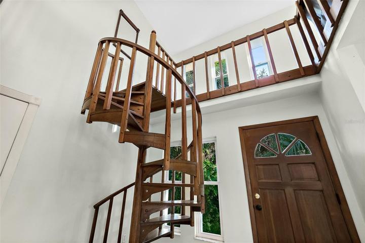 Spiral staircase to upper level.