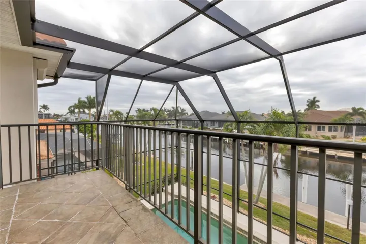 2nd floor outside screened deck - view of pool/canal