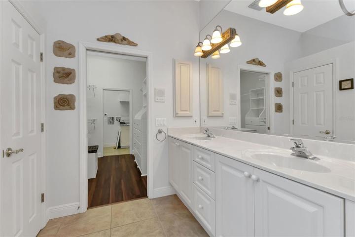 Primary Bathroom double sinks - view to Primary Bedroom Closet